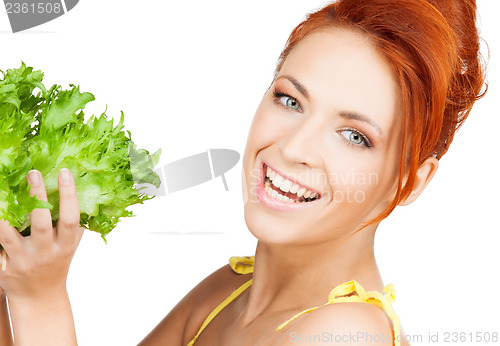 Image of woman holding lettuce