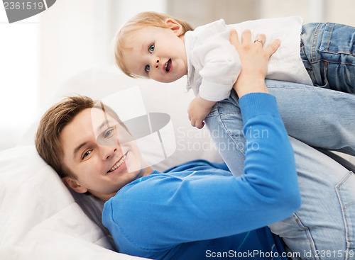 Image of happy father with adorable baby