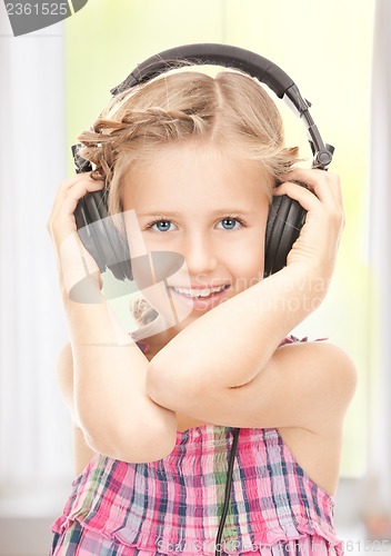 Image of happy girl in big headphones