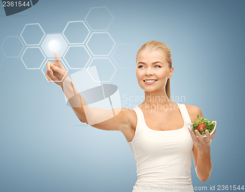 Image of woman with salad and virtual screen