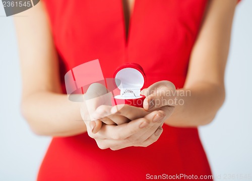 Image of woman showing wedding ring on her hand