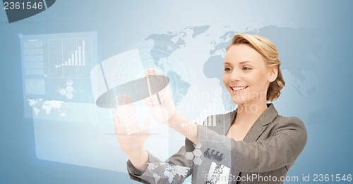 Image of businesswoman working with virtual screens