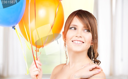 Image of happy teenage girl with balloons