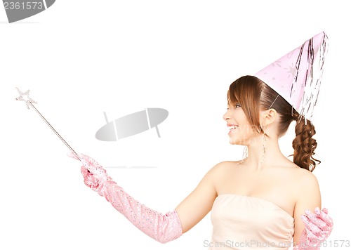 Image of girl in party cap with magic stick