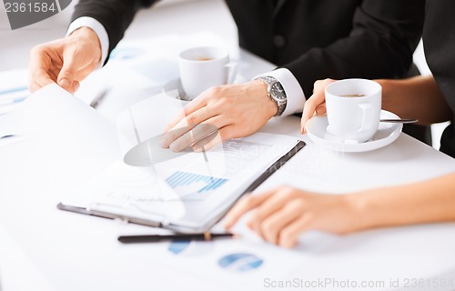 Image of woman hand signing contract paper