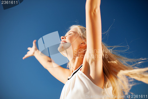 Image of beautiful woman enjoying summer outdoors