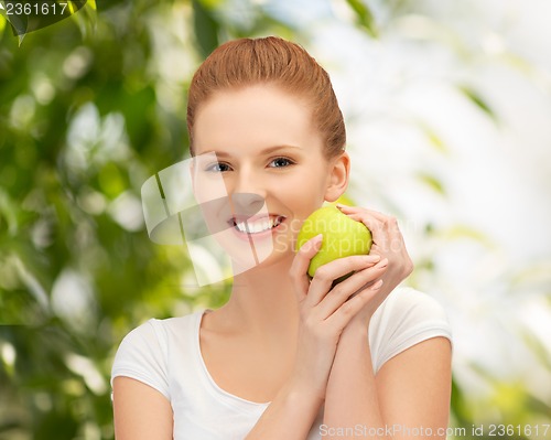 Image of young beautiful woman with green apple