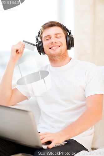 Image of man with headphones listening to music