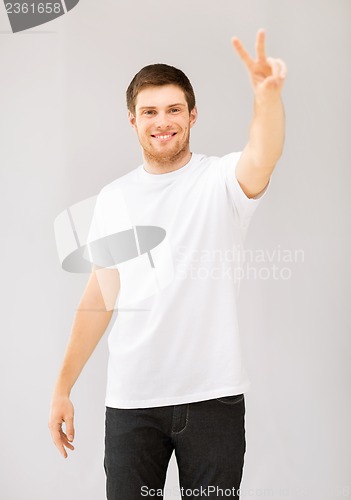 Image of man showing victory or peace sign