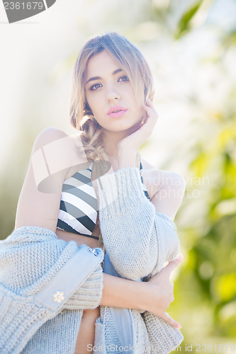 Image of fashion model posing on the beach