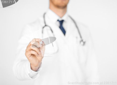 Image of doctor writing something in the air