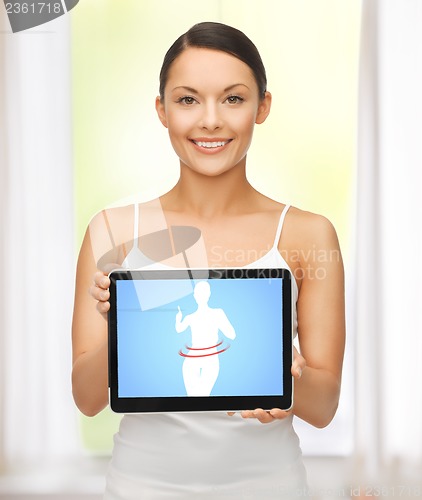 Image of woman holding tablet pc with dieting application