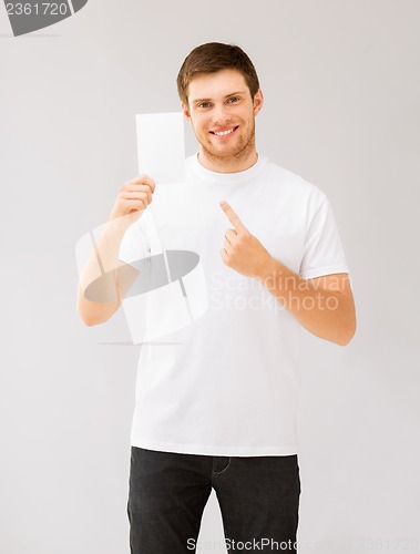 Image of man pointing at blank white paper