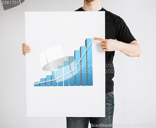 Image of man holding board with 3d graph