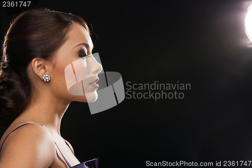 Image of woman with diamond earrings