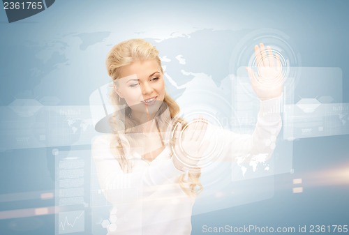 Image of businesswoman working with virtual screens