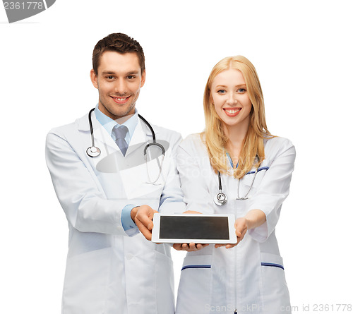 Image of young doctors showing tablet pc