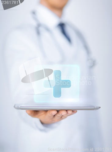 Image of male doctor holding tablet pc with medical app