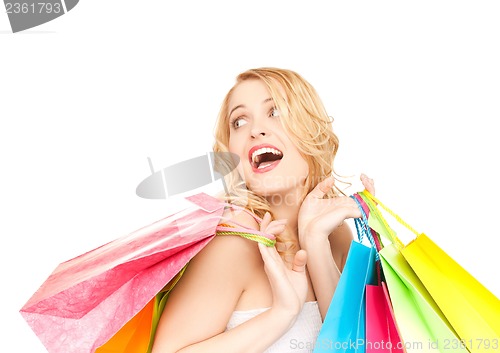 Image of excited woman with shopping bags