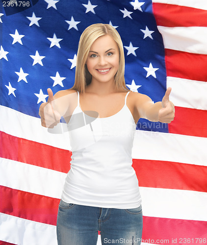 Image of teenage girl in blank white t-shirt with thumbs up