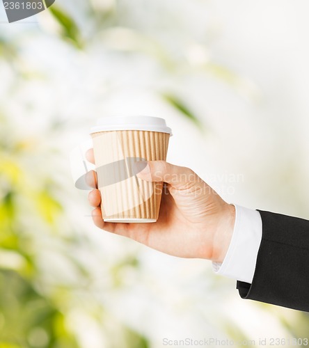 Image of man hand holding take away coffee