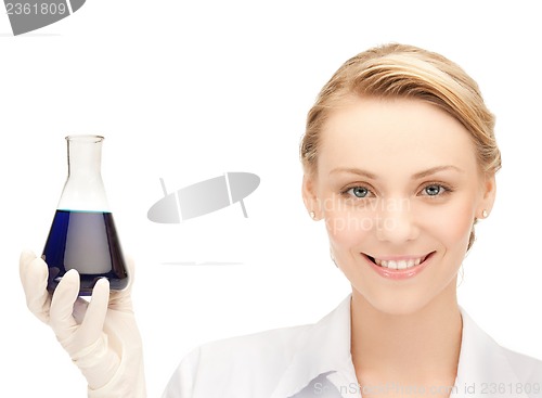 Image of female chemist holding bulb with chemicals