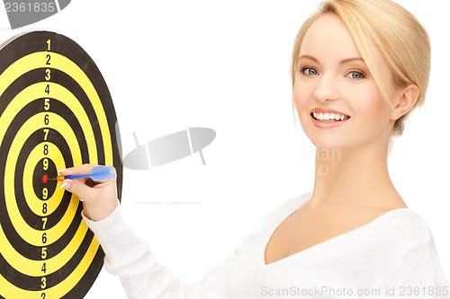 Image of businesswoman with dart and target