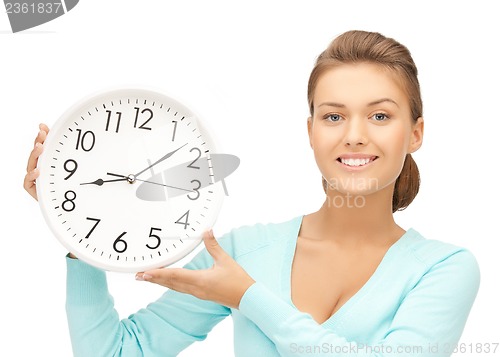Image of woman with wall clock