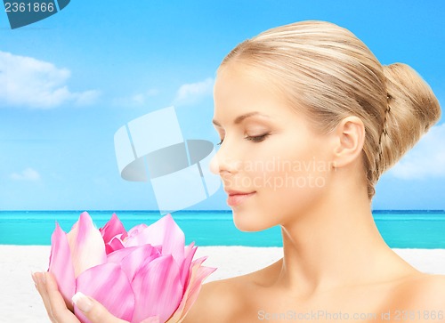 Image of lovely woman with lotos flower