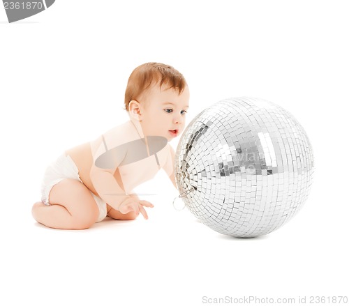 Image of child playing with disco ball