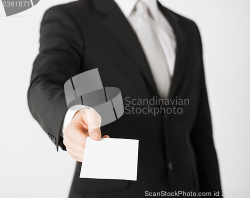 Image of man hand with blank paper