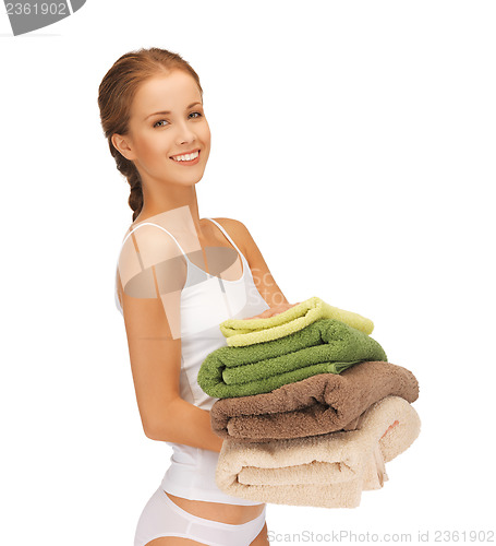 Image of lovely housewife with towels