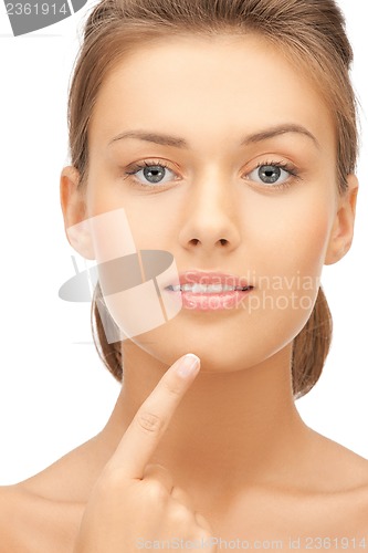 Image of woman touching her chin