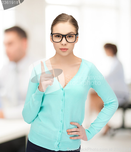 Image of girl showing warning gesture