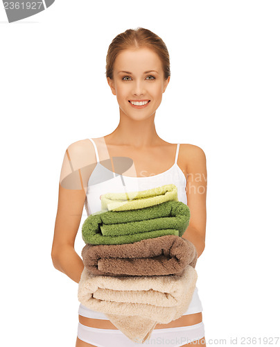 Image of lovely housewife with towels