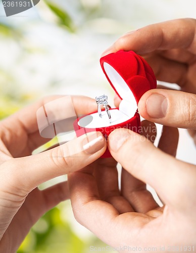 Image of couple with wedding ring and gift box