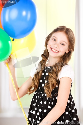 Image of happy girl with colorful balloons