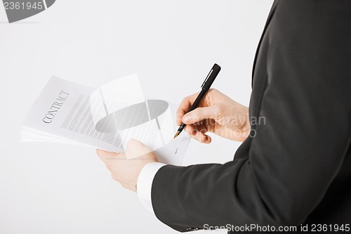 Image of man with contract