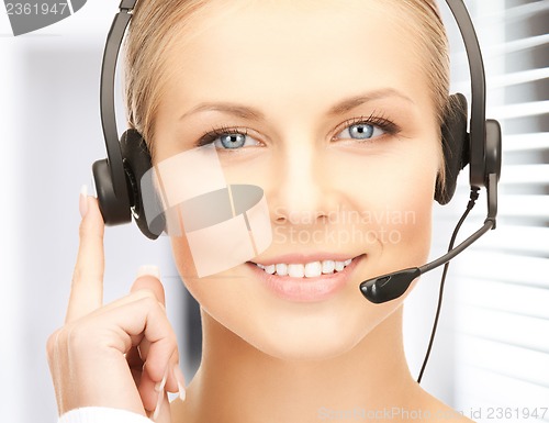 Image of friendly female helpline operator