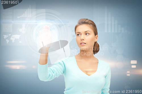 Image of businesswoman working with something imaginary