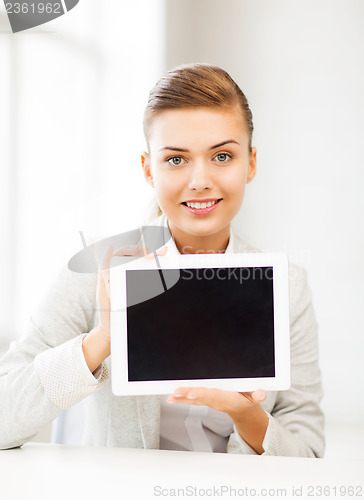 Image of businesswoman with tablet pc in office