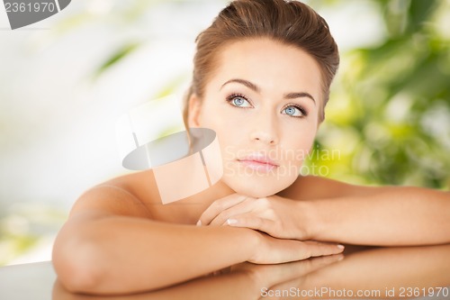 Image of woman with mirror