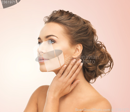Image of face and hands of beautiful woman