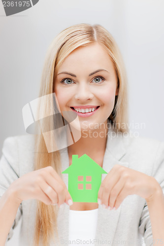 Image of woman with illustration of eco house