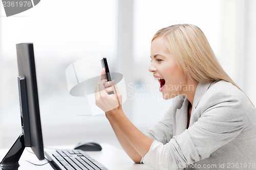 Image of angry woman with phone