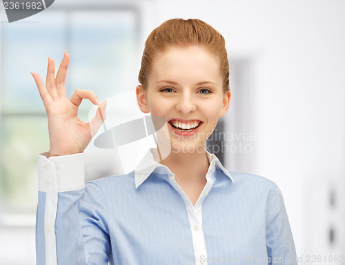 Image of young woman showing ok sign