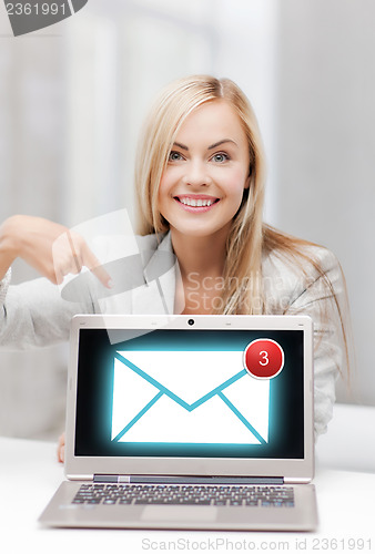 Image of businesswoman with laptop computer