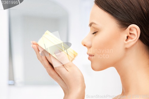 Image of beautiful woman with moisturizing creme