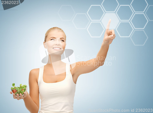 Image of woman with salad and virtual screen