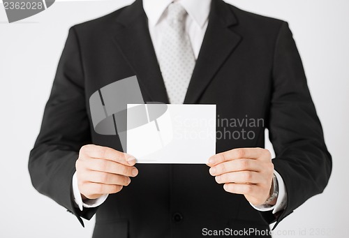 Image of man hand with blank paper